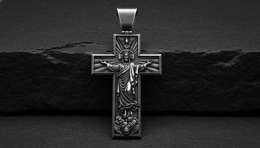925 sterling silver Jesus cross pendant with black rhodium finish and detailed religious carving on dark background