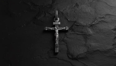 925 sterling silver crucifix pendant with detailed Jesus figure and INRI inscription on textured stone background