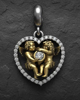 Silver angel heart pendant with gold vermeil finish displaying intricate cherub craftsmanship and bail detail