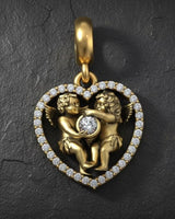 Gold vermeil angel heart pendant with two cherubs embracing around diamond center on textured background