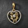 Gold vermeil angel heart pendant with two cherubs embracing around diamond center on textured background
