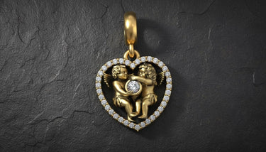 Gold vermeil angel heart pendant with two cherubs embracing around diamond center on textured background