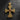 Gold vermeil Celtic Cross Pendant featuring intricate scrollwork and a square-cut red garnet, photographed on a dark slate stone.
