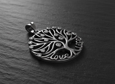 Side angle view of oxidized silver tree pendant showing dimensional branches and sparkling CZ stone details