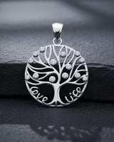 Close-up of handcrafted tree of life pendant displaying intricate branch work and premium sterling silver finish