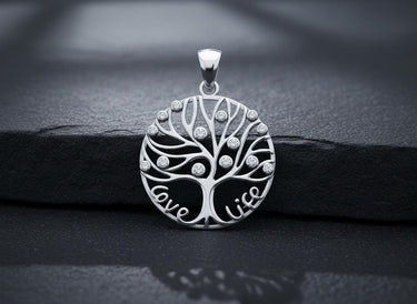 Close-up of handcrafted tree of life pendant displaying intricate branch work and premium sterling silver finish