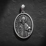 Saint Nicholas pendant in gold vermeil finish showing detailed bishop design on dark textured background