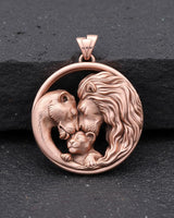 Rose gold finish lion family pendant displaying intricate metalwork and family symbolism in circular design