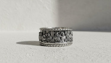 925 sterling silver Last Supper ring with detailed biblical scene engraving displayed on neutral background