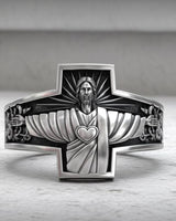 925 sterling silver Jesus cross ring with Christ the Protector design and sacred heart detail on marble surface