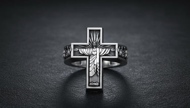 925 sterling silver Jesus cross ring with Christ the Redeemer design and ornate Celtic band on textured surface