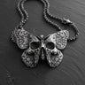 925 sterling silver butterfly skull pendant with detailed wings and gothic design on dark wooden surface