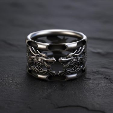 925 sterling silver dragon ring with dual dragon heads and oxidized finish on dark slate background
