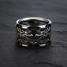 925 sterling silver dragon ring with dual dragon heads and oxidized finish on dark slate background