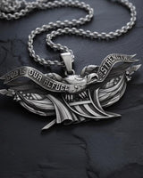 Detailed view of patriotic eagle pendant showing intricate wing feathers and religious message engraving
