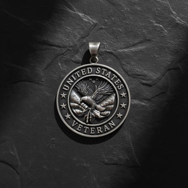 Handcrafted veteran pendant in sterling silver with detailed eagle wings and United States inscription detail view