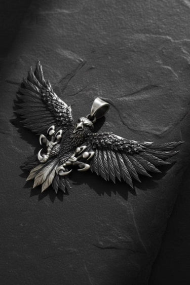 Close-up of flying eagle pendant with sharp talons and textured featherwork in premium 925 silver