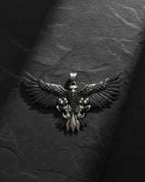 Front view of handcrafted eagle pendant showing intricate wing details and oxidized finish on sterling silver