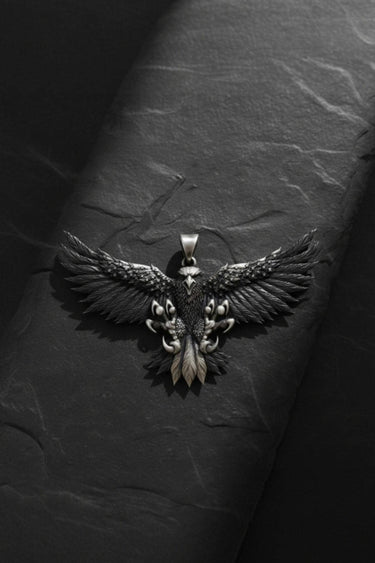 Front view of handcrafted eagle pendant showing intricate wing details and oxidized finish on sterling silver