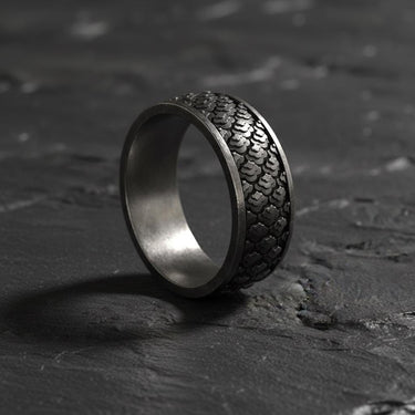 Close-up detail of traditional Japanese scale pattern engraved on sterling silver ring with textured finish
