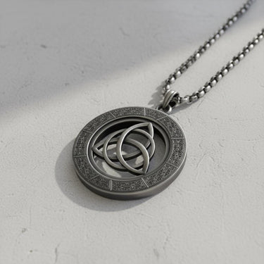 Close-up of triquetra pendant highlighting intricate three-loop design and textured knotwork craftsmanship