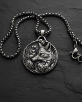 925 sterling silver fox pendant with botanical engravings displayed on dark slate background showing intricate detail