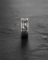 Close-up profile of sterling silver Aztec ring displaying intricate Mayan symbols and band thickness detail