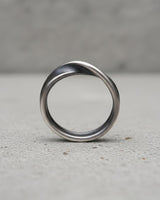 Profile shot of sterling silver infinity ring demonstrating seamless Mobius band construction and polish