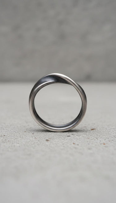 Profile shot of sterling silver infinity ring demonstrating seamless Mobius band construction and polish