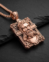 Detailed view of handcrafted Jesus portrait cross pendant showing sacred heart and crown of thorns artwork