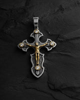 925 sterling silver crucifix pendant with detailed Jesus figure and CZ stones on dark wooden surface