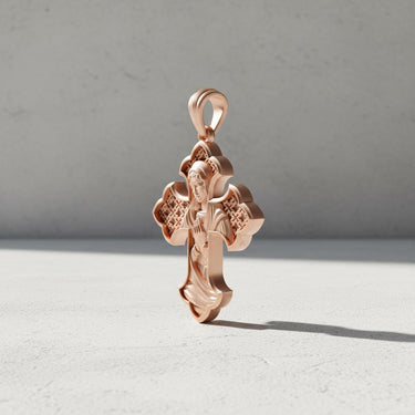 Close-up of Madonna cross pendant displaying intricate religious engravings and premium craftsmanship