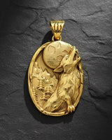 Gold vermeil howling wolf pendant with intricate relief carving of moon and forest scene on black background