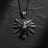 925 sterling silver wolf medallion pendant with spiked design held in hand showing detailed craftsmanship