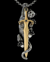 925 sterling silver panther sword pendant with gold vermeil blade and ruby crystal eyes on black background