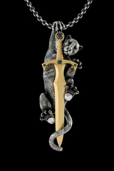 925 sterling silver panther sword pendant with gold vermeil blade and ruby crystal eyes on black background