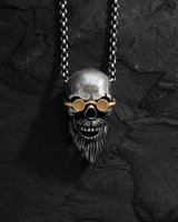 Front view of the handcrafted 925 sterling silver bearded skull pendant, highlighting the oxidized details and gold goggles.