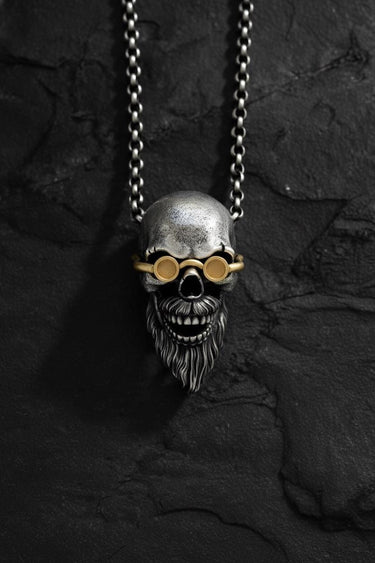 Front view of the handcrafted 925 sterling silver bearded skull pendant, highlighting the oxidized details and gold goggles.