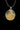 Angled view of the handcrafted Saint Mark pendant showing the detailed relief and the Latin scripture on the tablet.