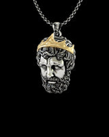 Close-up view of Zeus pendant showing intricate two-tone metalwork and classical mythology design details