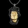 925 sterling silver Medusa pendant with gold vermeil face and oxidized snake hair details on black background