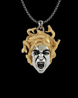 925 sterling silver Medusa pendant with gold vermeil snake hair and fierce expression on black background