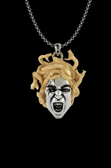 925 sterling silver Medusa pendant with gold vermeil snake hair and fierce expression on black background