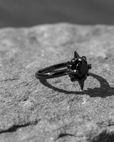 Side angle view of celestial north star ring displaying handcrafted metalwork and dramatic spike design details