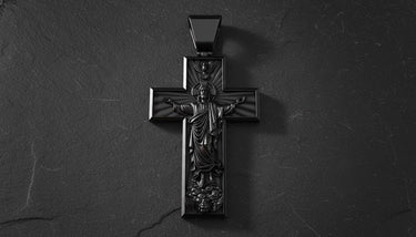 Gothic cross pendant showing Jesus Christ figure with eagle and intricate metalwork in sterling silver jewelry