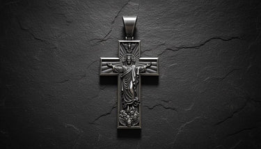 Close-up view of handcrafted Jesus cross pendant displaying black rhodium plating and religious sculptural details