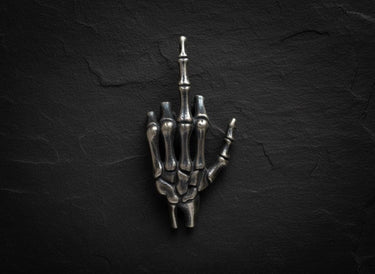 Close-up of anatomical hand bones design with intricate phalange details in premium silver pendant