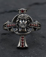 925 sterling silver Jesus face ring with oxidized finish and red stone cross accents front view