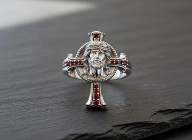 Detailed view of handcrafted Jesus cross ring showing Christ portrait and oxidized silver finish details