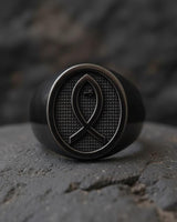 Side angle view of handcrafted religious fish ring showing black rhodium plating and sterling silver band detail